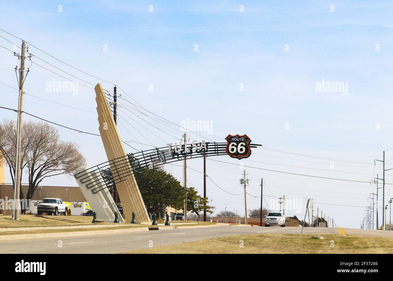 Tulsa Oklahoma USA 3 9 2018-Art Deco Route 66 sign extending over highway by Daylight Donut warehouse leaving city to the east Stock Photo