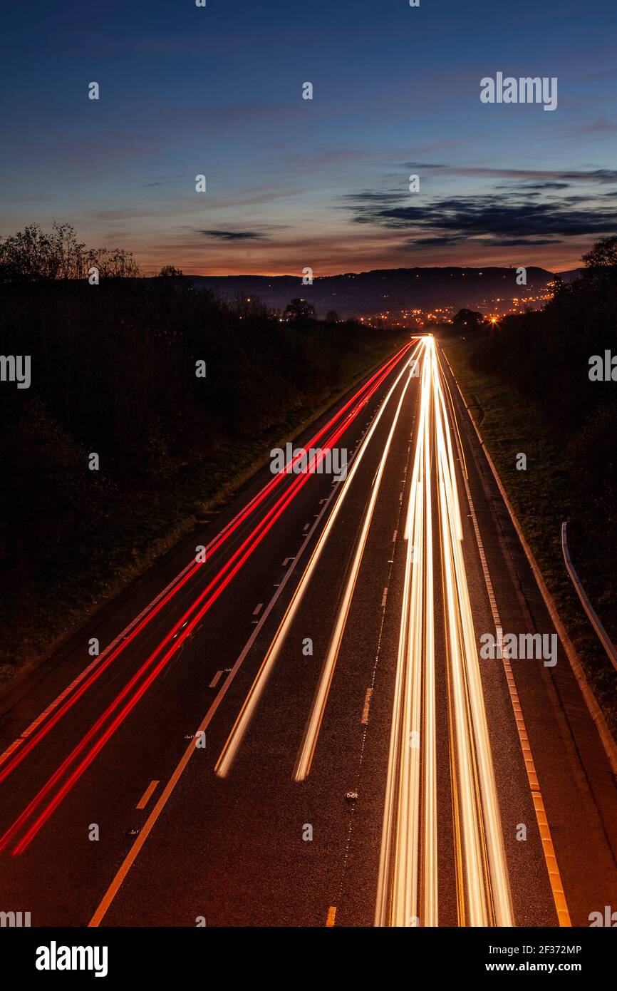 Traffic trails at dusk, North Wales Stock Photo