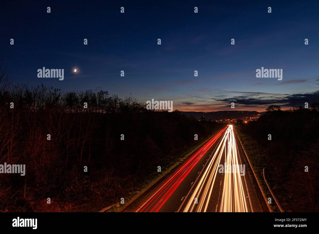 Traffic trails at dusk, North Wales Stock Photo