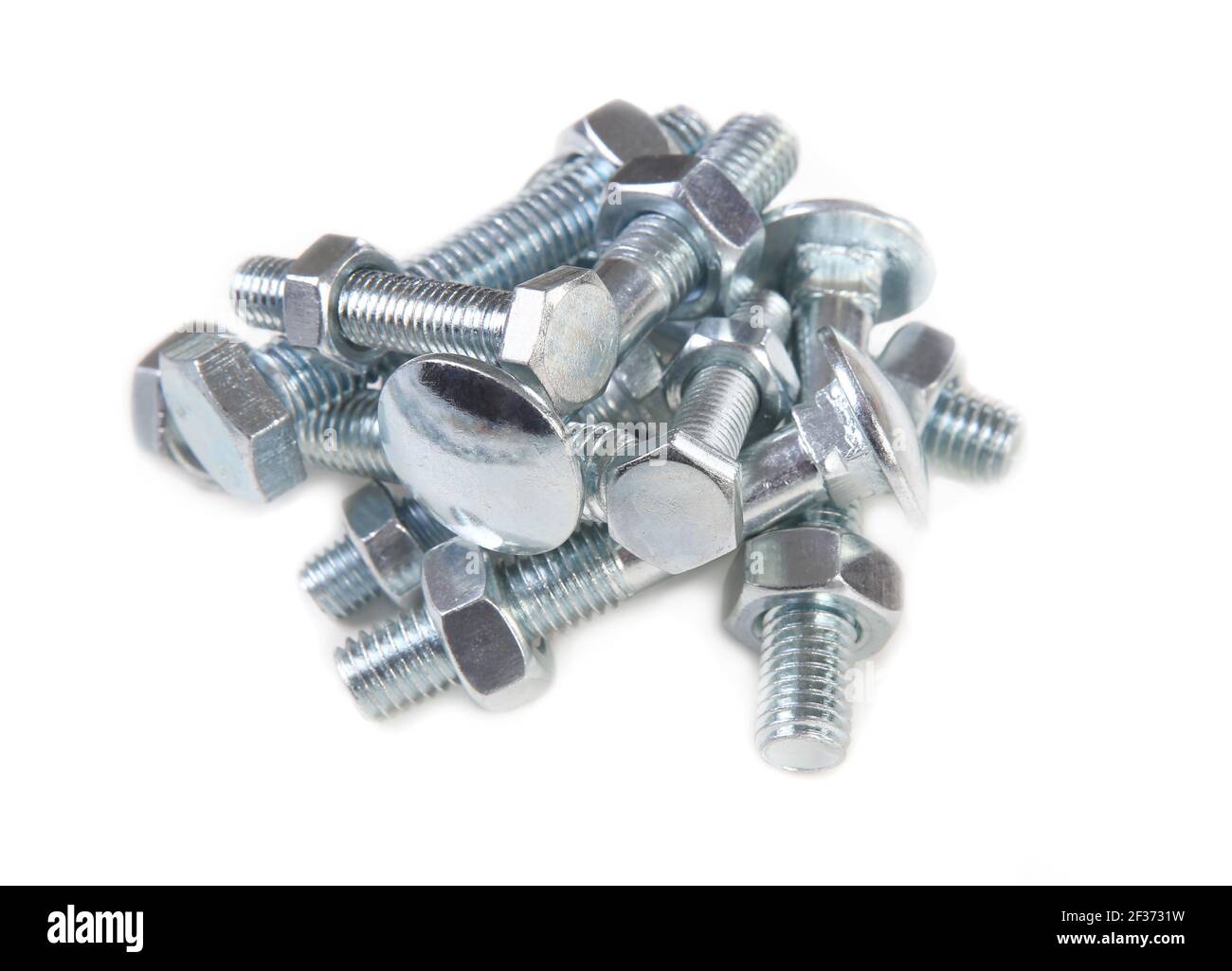 Heap of bolts and nuts. Isolated on a white background. Stock Photo