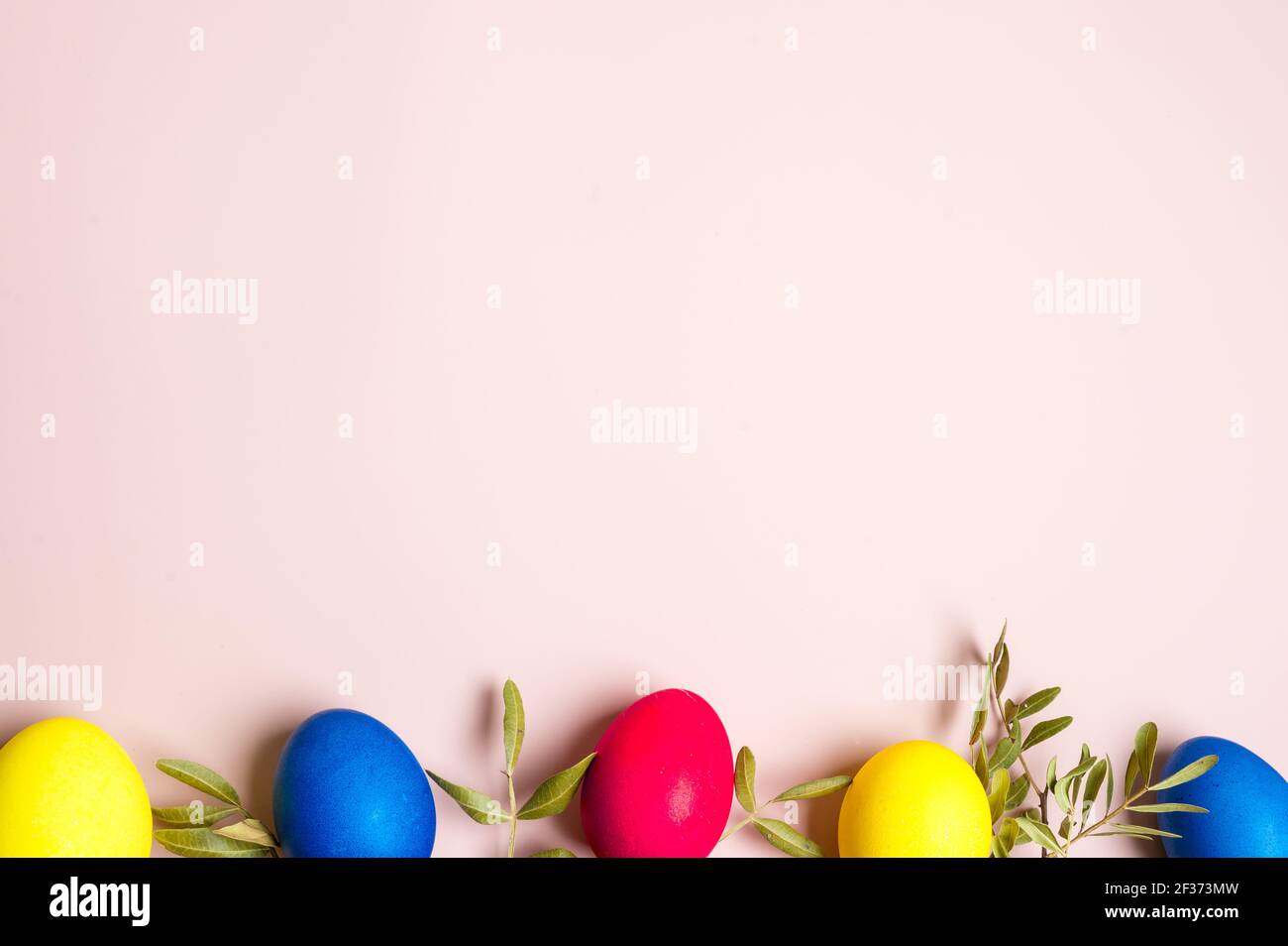 Multi-colored Easter eggs. Yellow, pink and blue. Minimal concept Stock Photo
