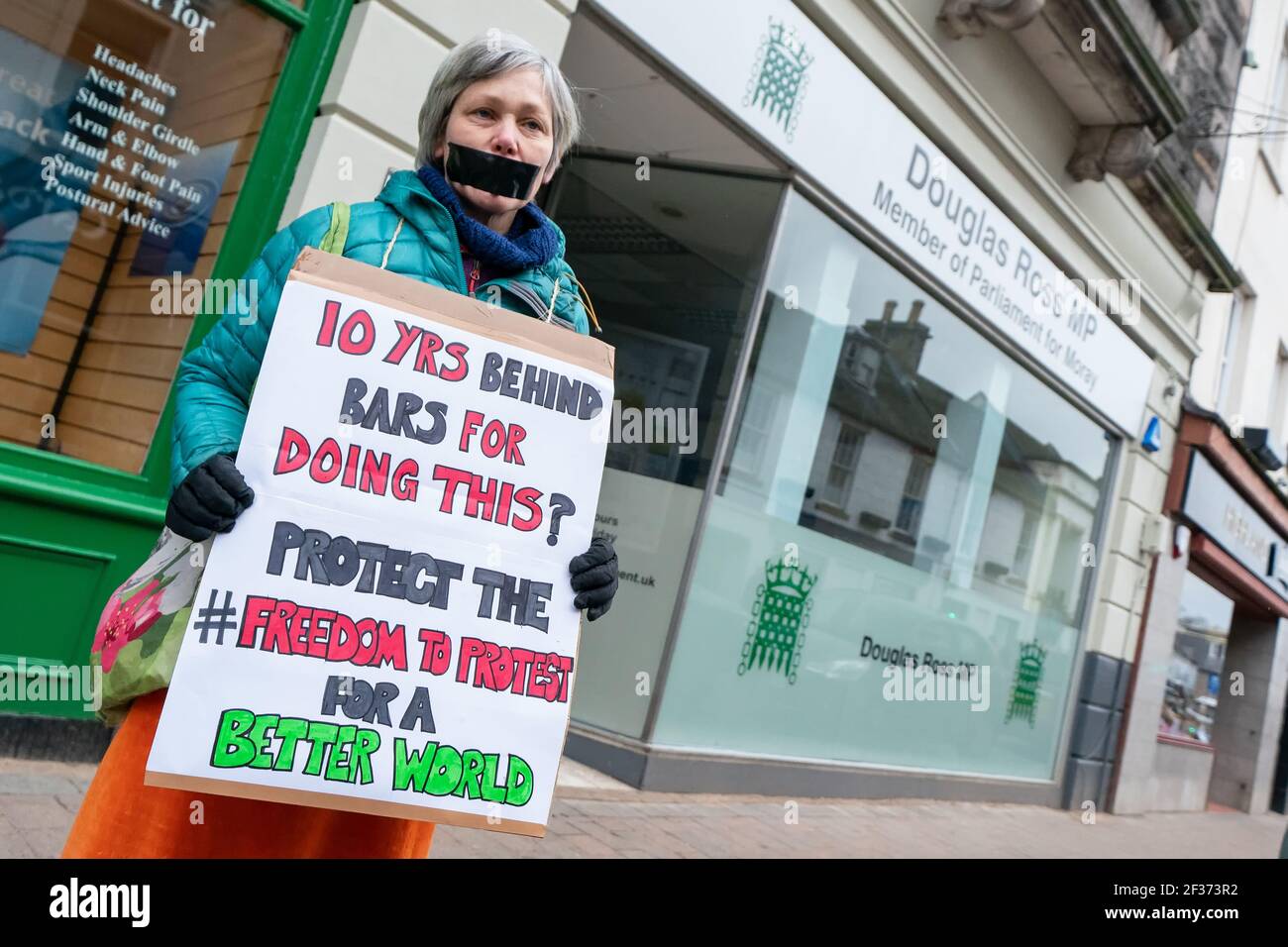 Outside MP Douglas Ross Office, High Street, Forres, Moray, UK. 15th Mar, 2021. UK. These are members from various groups in the Forres area protesting relative to the Police Bill and Freedom to Protest. Credit: JASPERIMAGE/Alamy Live News Stock Photo