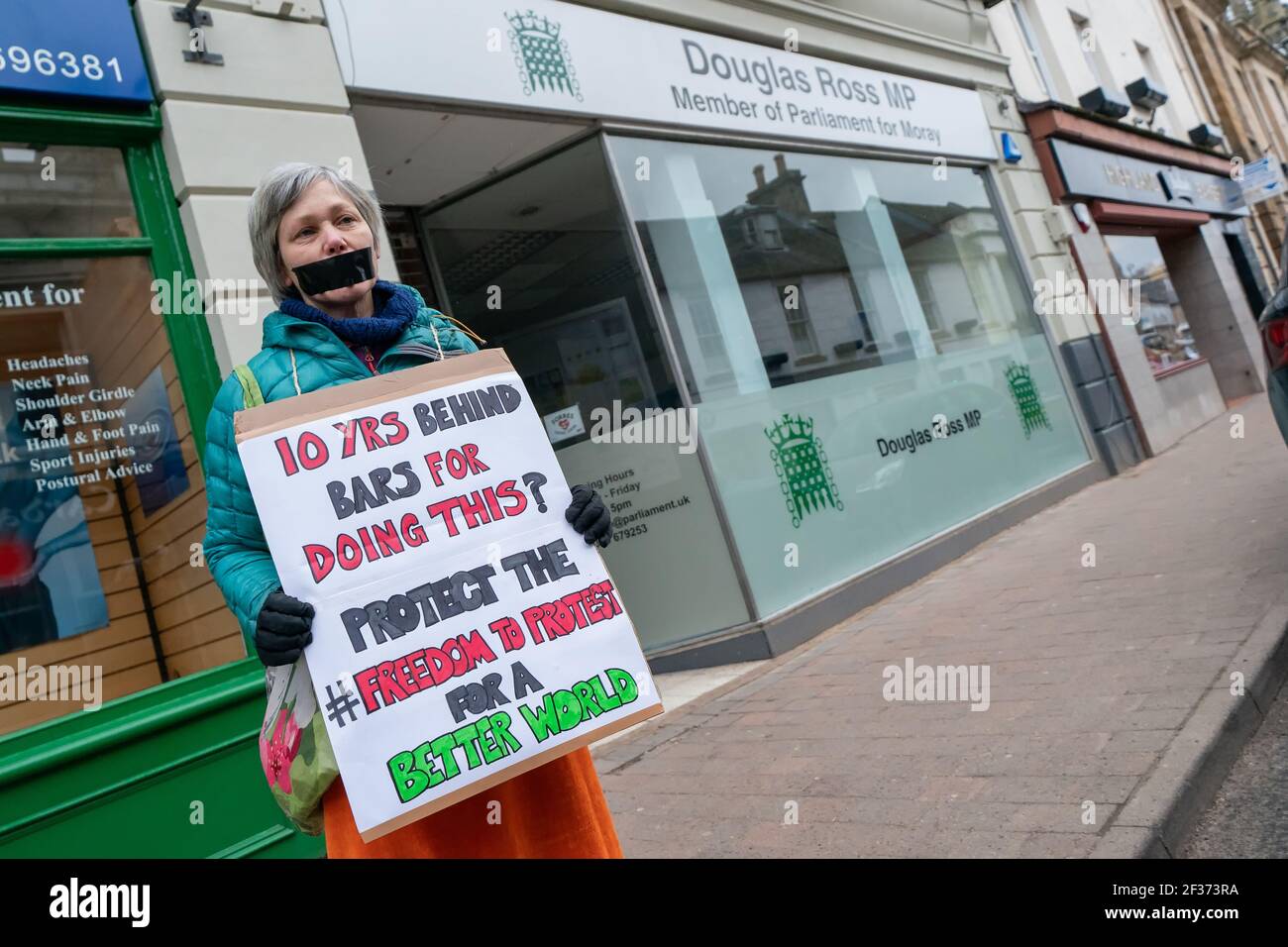 Outside MP Douglas Ross Office, High Street, Forres, Moray, UK. 15th Mar, 2021. UK. These are members from various groups in the Forres area protesting relative to the Police Bill and Freedom to Protest. Credit: JASPERIMAGE/Alamy Live News Stock Photo