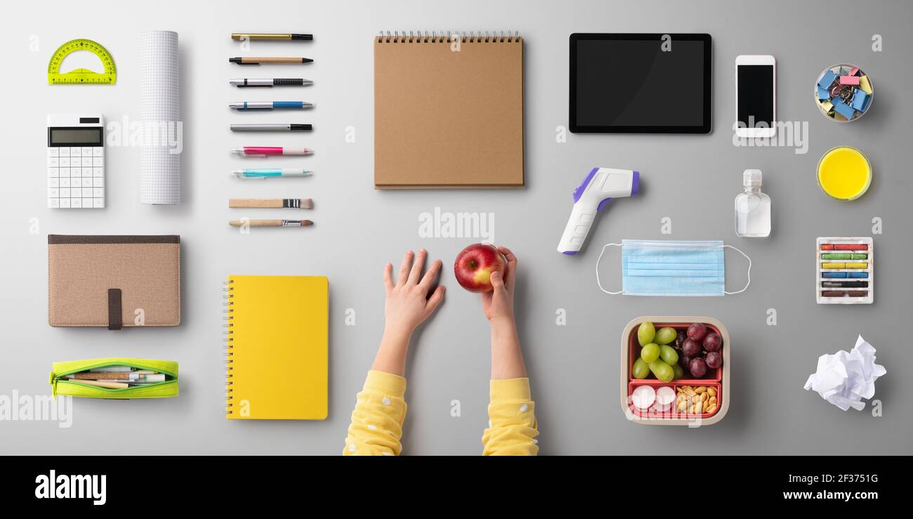 Flat lay top view of face mask and school supplies, back to school and ...