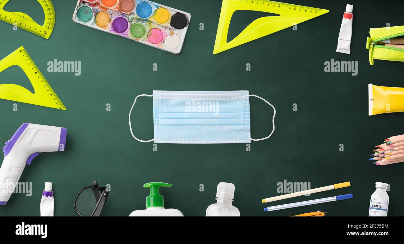 Flat lay top view of face mask and school supplies, back to school and ...