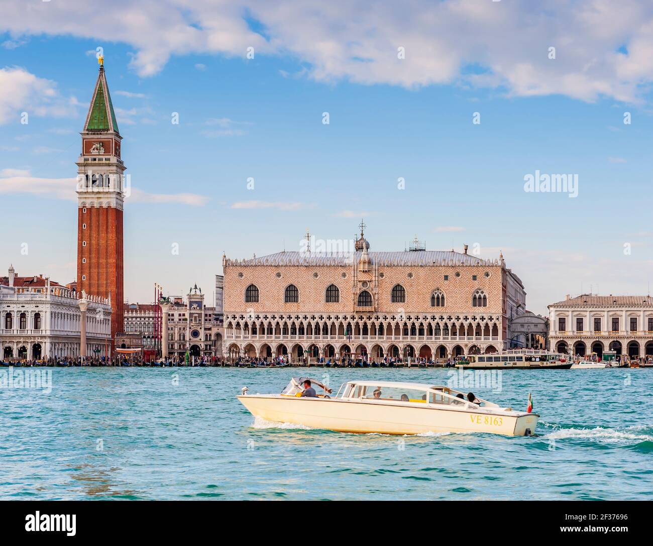 Doge's Palace and Campanile in Piazza San Marco and a speedboat taxi in Venice in Veneto, Italy Stock Photo