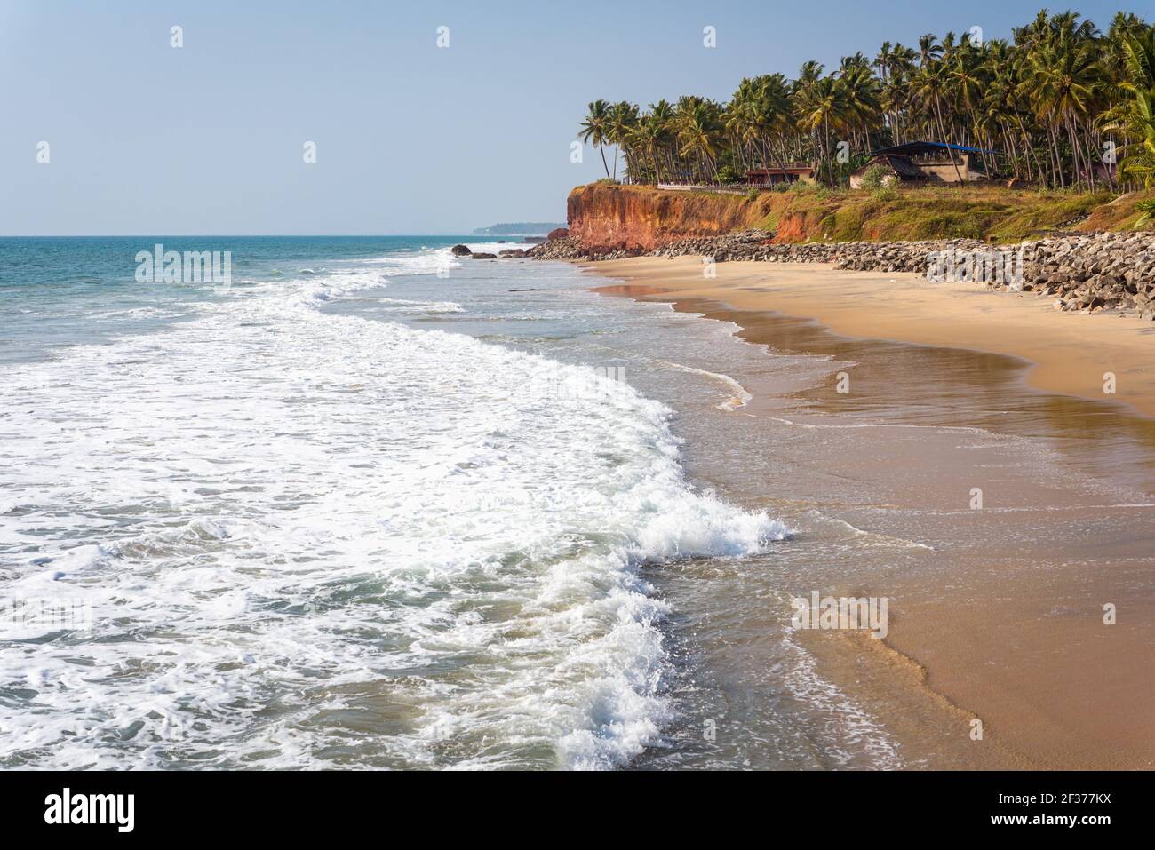 Beautiful beach in Varkala, India: foamy sea waves, sand, and palm ...