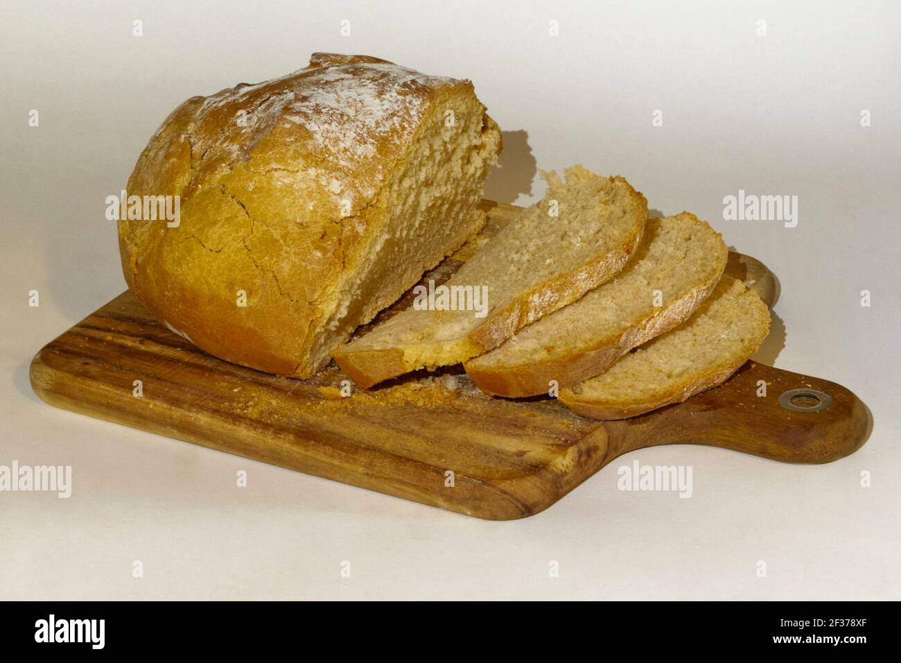 Sliced white bread in a cutting board Stock Photo