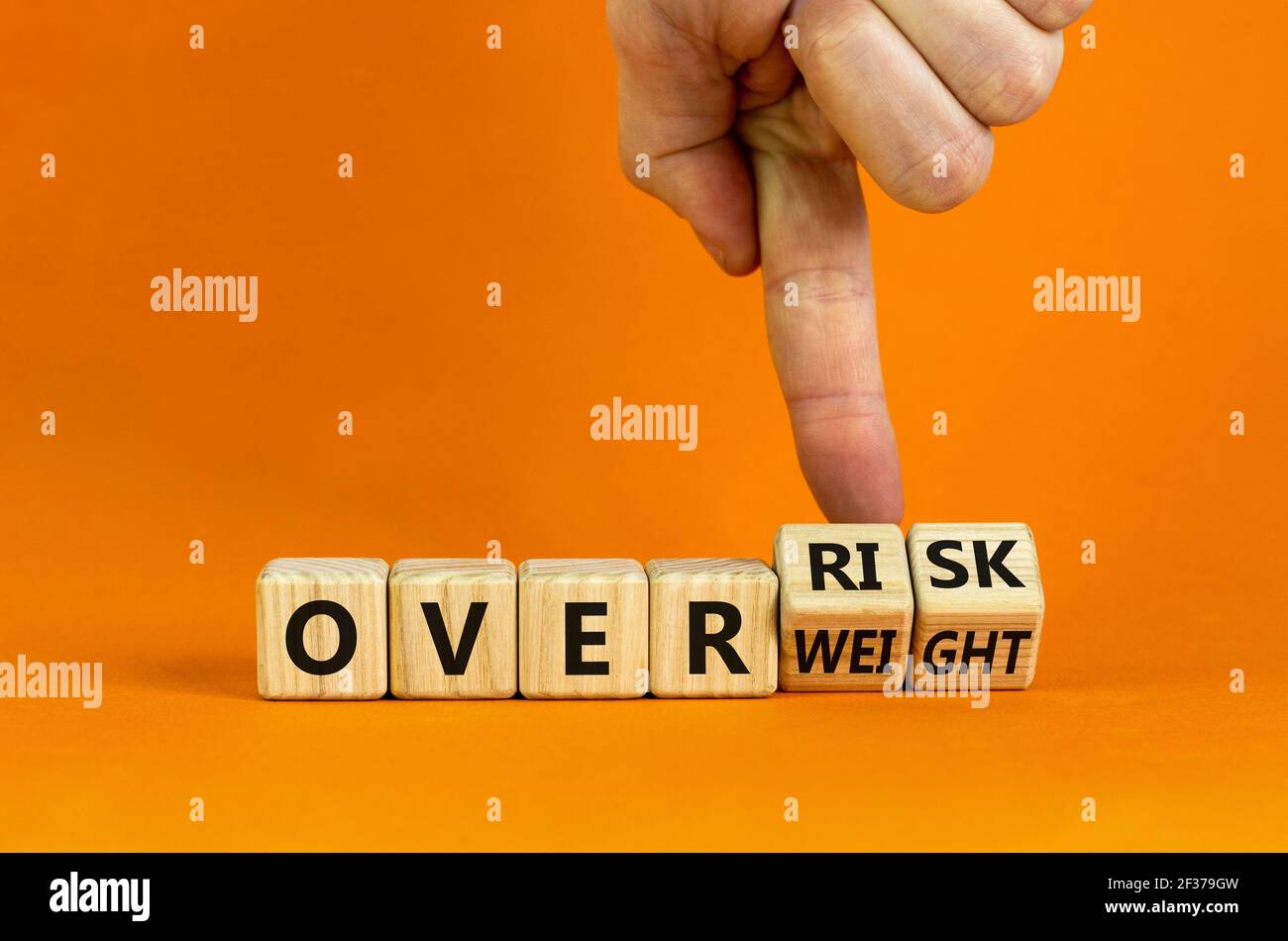 High risk from overweight symbol. Doctor turns wooden cubes and changes ...