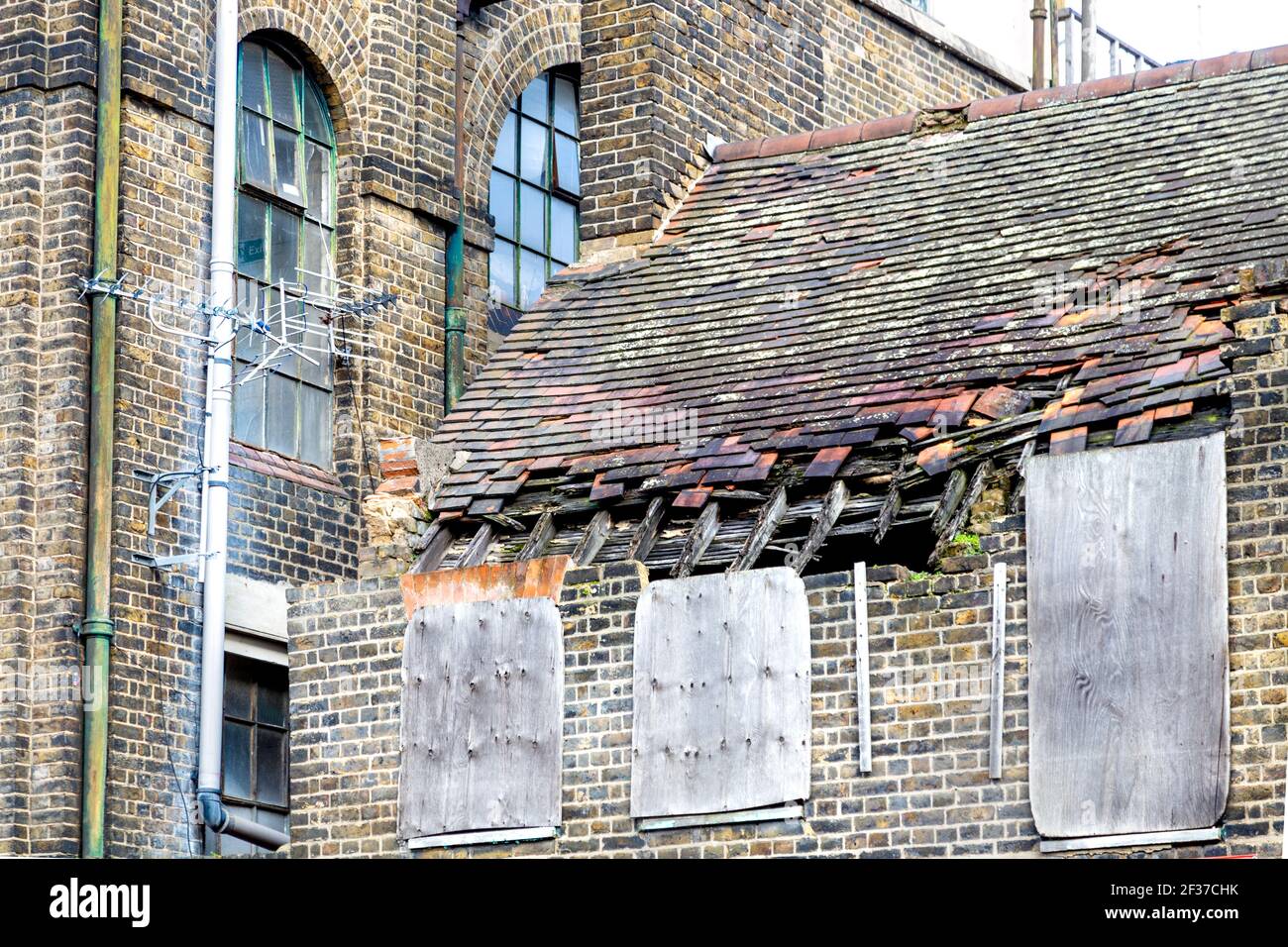 Old building with damaged, dilapidated roof Stock Photo