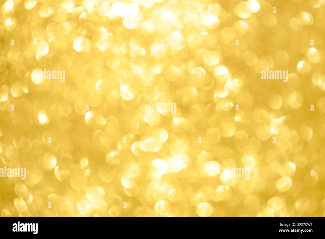 Abstract shiny glitter christmas or new year background. Light Gold glitter  background with sparkling texture. Golden shimmering light, sequins sparks  Stock Photo - Alamy