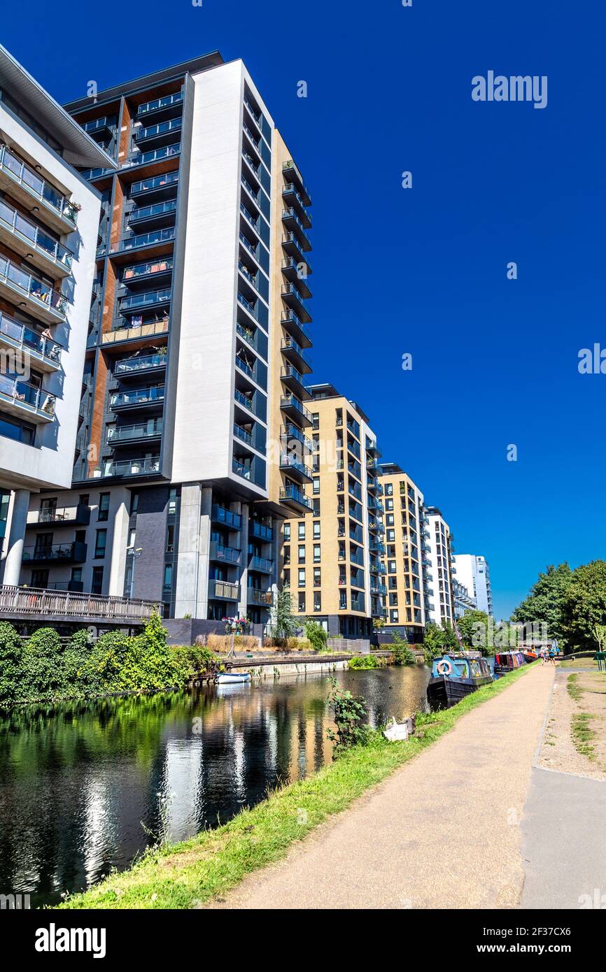 New-build residentail tower clocks along the Regent's Canal in Mile End, London, UK Stock Photo