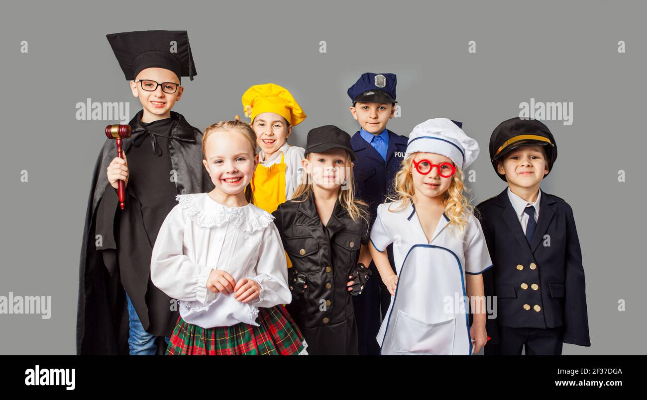 Group of children dressed in costumes of different professions Stock Photo