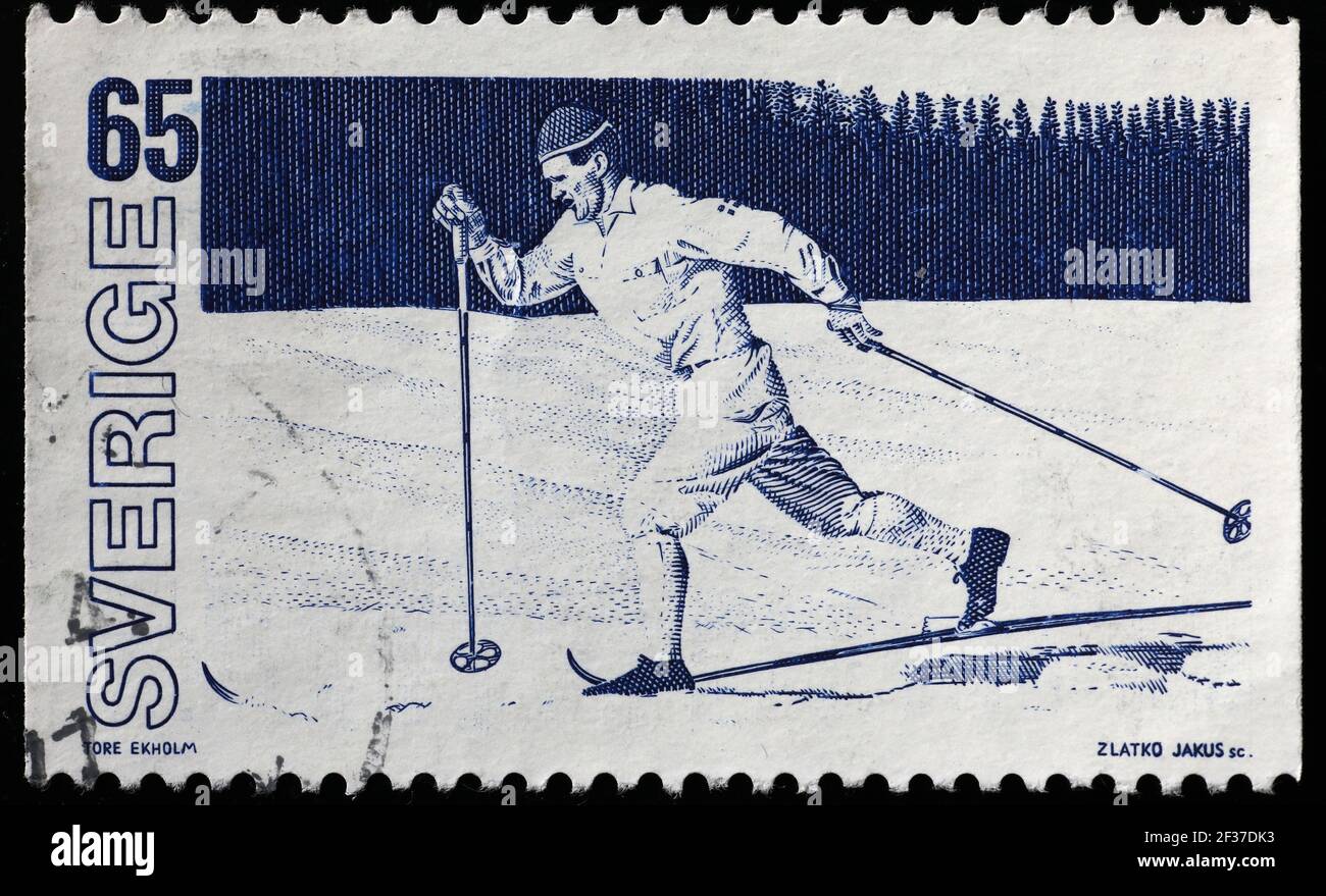 Cross-country ski racer on old swedish postage stamp Stock Photo