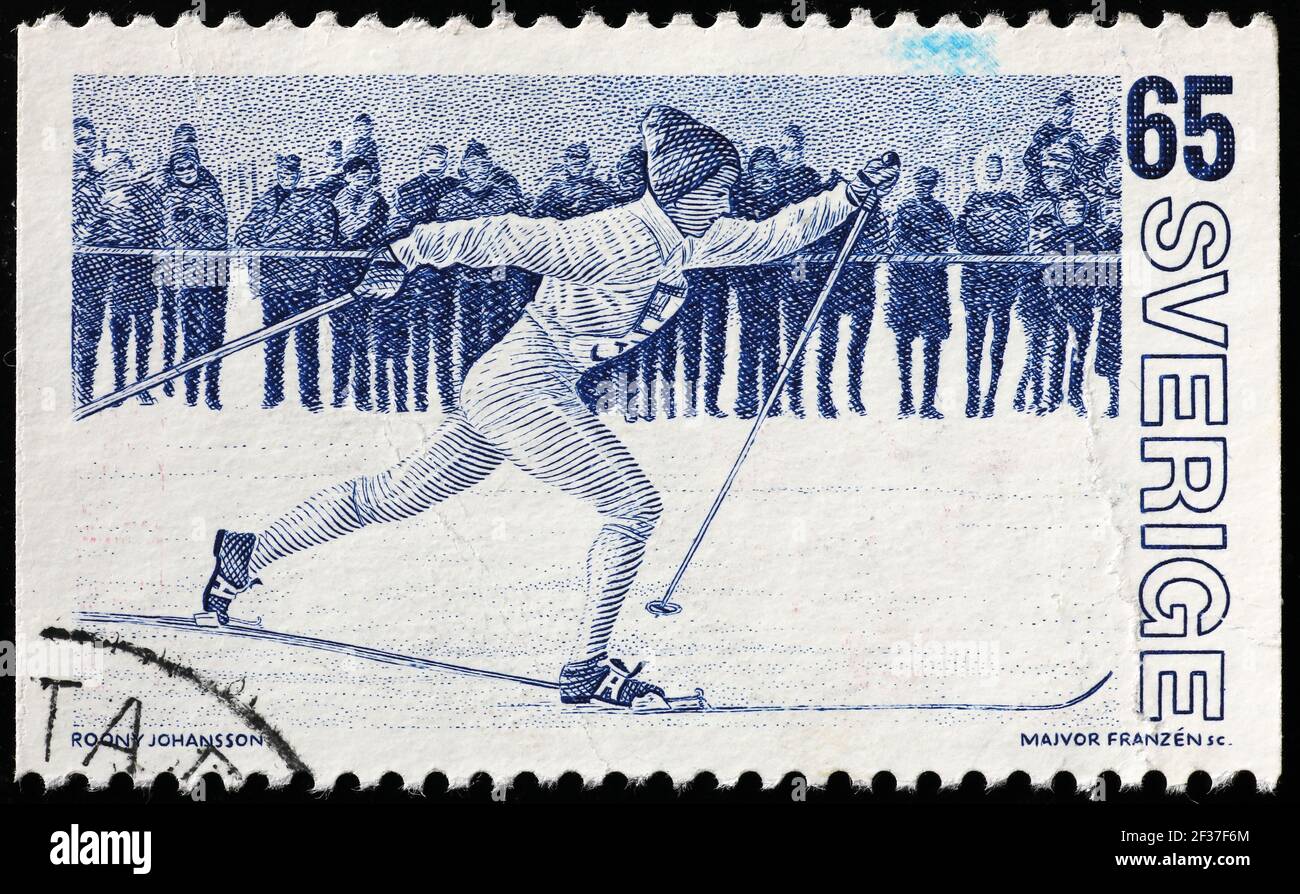 Woman cross-country ski racer on swedish postage stamp Stock Photo