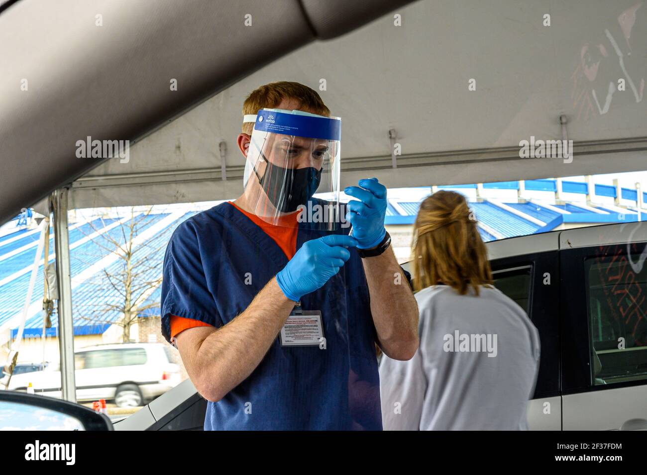 A nurse prepares a syringe at a Vaccine distribution center in Hoover, Alabama organized by the University of Alabama, Birmingham, UAB. Stock Photo