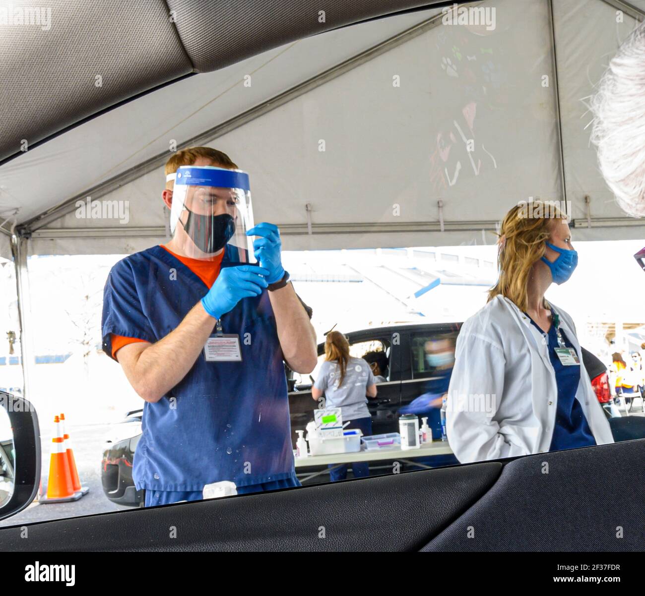 A nurse prepares a syringe at a Vaccine distribution center in Hoover, Alabama organized by the University of Alabama, Birmingham, UAB. Stock Photo