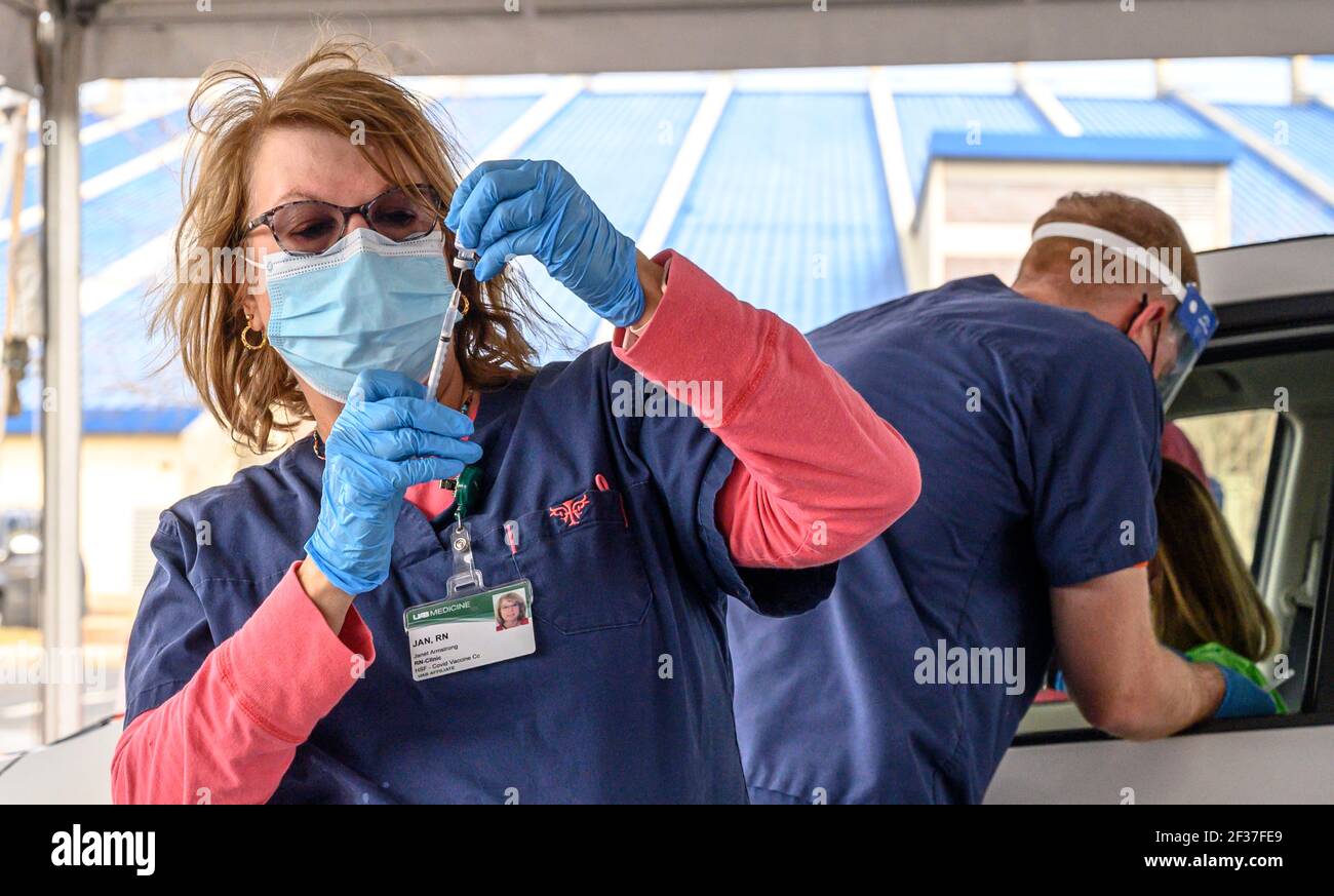 A nurse prepares a syringe at a Vaccine distribution center in Hoover, Alabama organized by the university of Alabama, Birmingham, UAB. Stock Photo