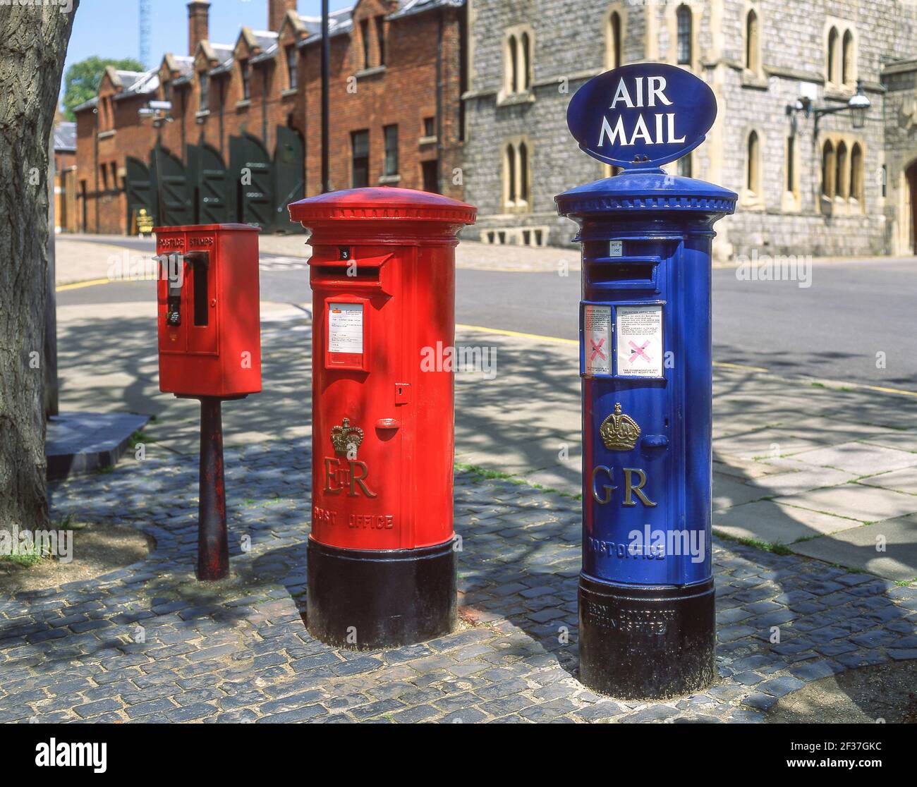 Royal Mail red & Royal Airforce blue pillar boxes,  High Street, Windsor, Berkshire, England, United Kingdom Stock Photo