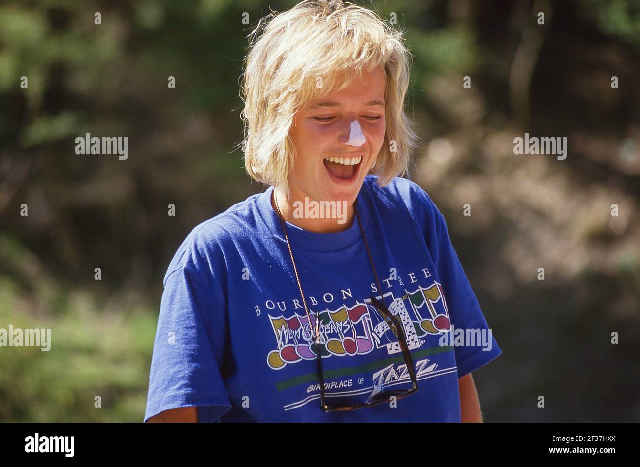 Young blonde woman outdoors, Cashmere, Christchurch, Canterbury, New Zealand Stock Photo