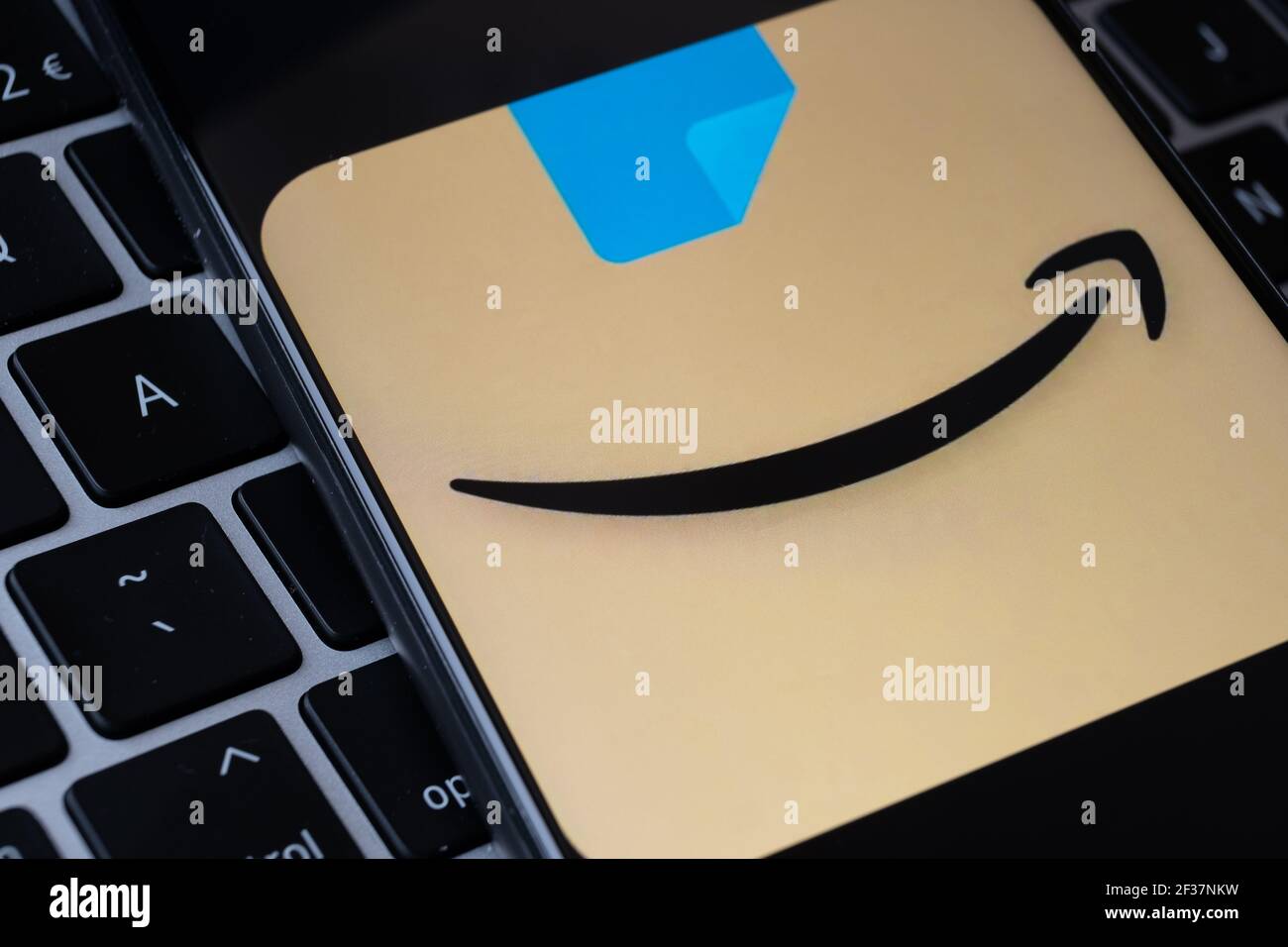 New rebranded amazon shopping app logo seen on the screen of smatphone whigh is placed on the keyboard. Concept for e-commerce and online shopping. St Stock Photo