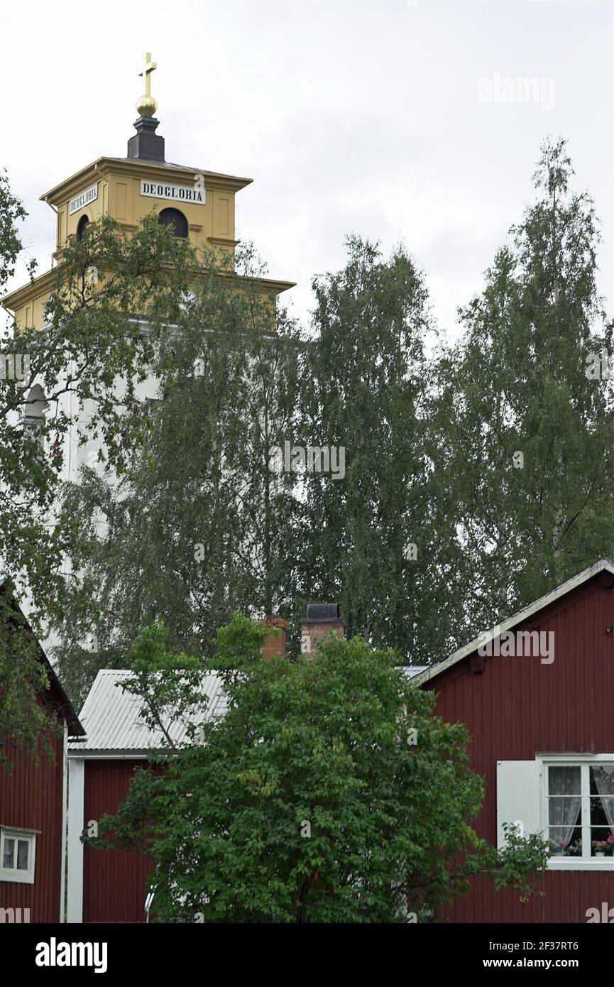 Sweden, Schweden; Gammelstad Church Town; Kirchendorf; Nederluleå Church - tower; Church tower sticking out from behind the trees. Stock Photo
