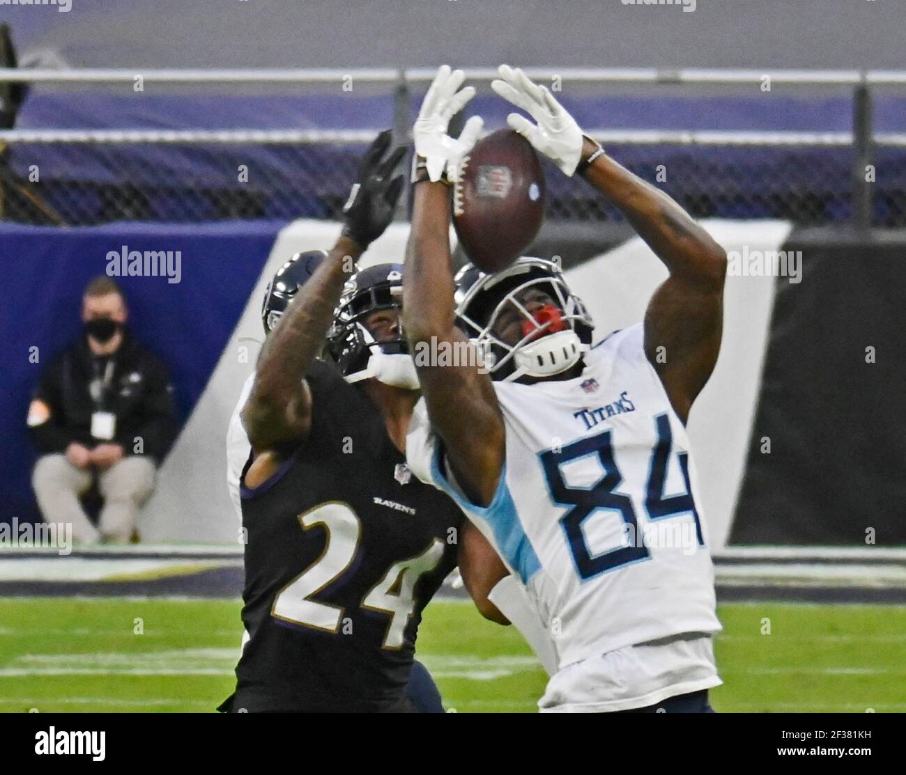 Baltimore, USA. 22nd Nov, 2020. Tennessee Titans' Corey Davis, right, catches an 11-yard pass in front of Baltimore Ravens' Marcus Peters during the Titans' game-winning drive in overtime on Sunday, Nov. 22, 2020 at M&T Bank Stadium in Baltimore, Maryland. Davis has signed a three-year deal with the New York Jets. (Photo by Kenneth K. Lam/Baltimore Sun/TNS/Sipa USA) Credit: Sipa USA/Alamy Live News Stock Photo