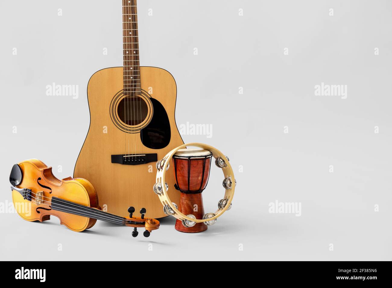 Instruments Light Background Different musical instruments on light background Stock Photo - Alamy