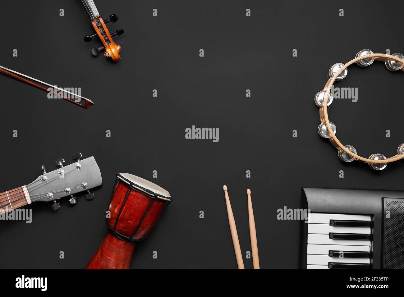Different musical instruments on dark background Stock Photo - Alamy