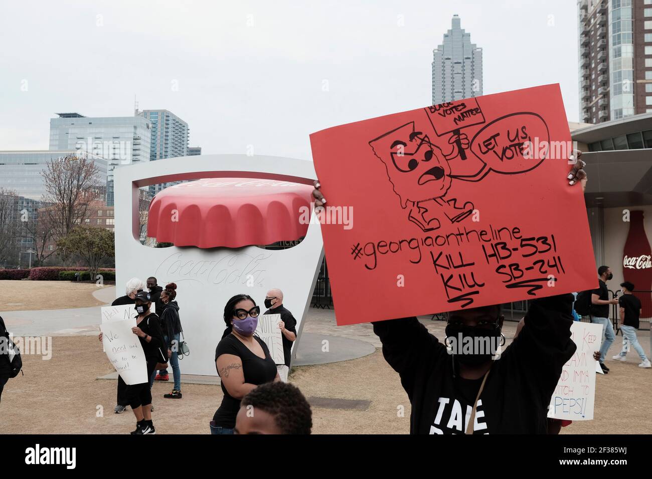 Protesting Coca Cola Atlanta, Georgia, USA. 15th Mar, 2021. Demonstrators in Atlanta hold a ...