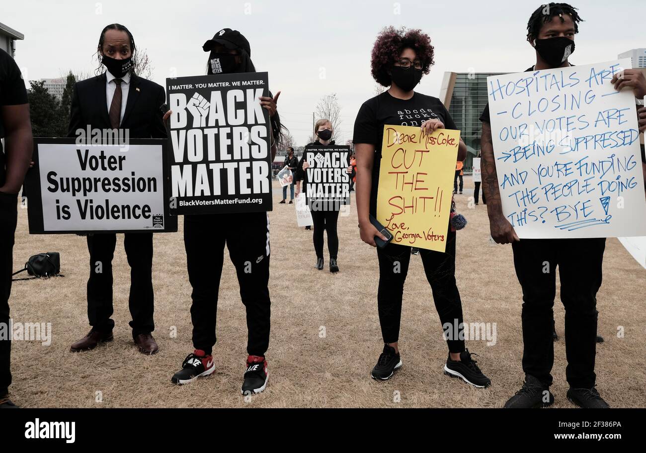 Protesting Coca Cola Atlanta, Georgia, USA. 15th Mar, 2021. Demonstrators in Atlanta hold a ...