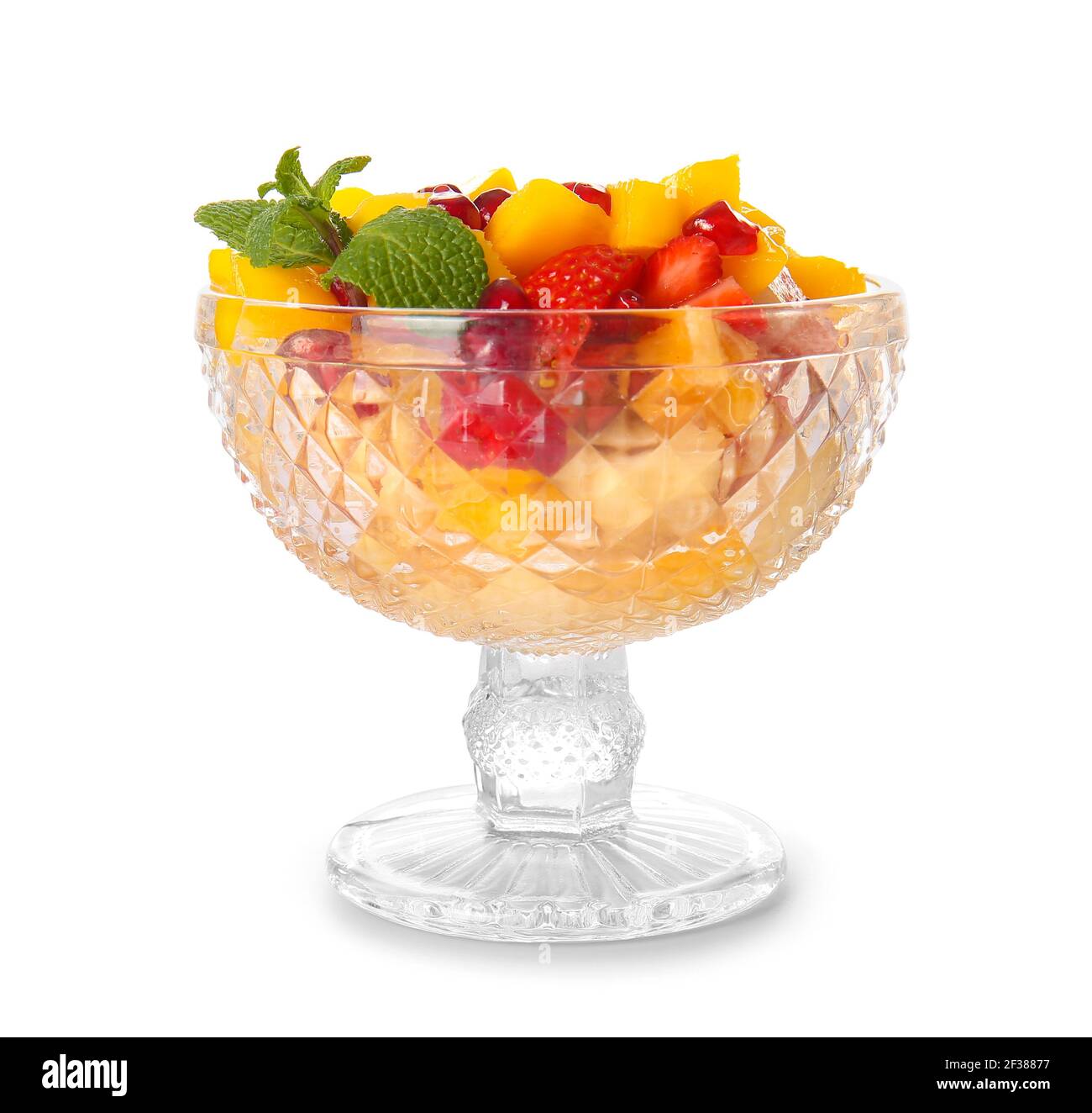 Glass bowl with tropical fruit salad on white background Stock Photo ...