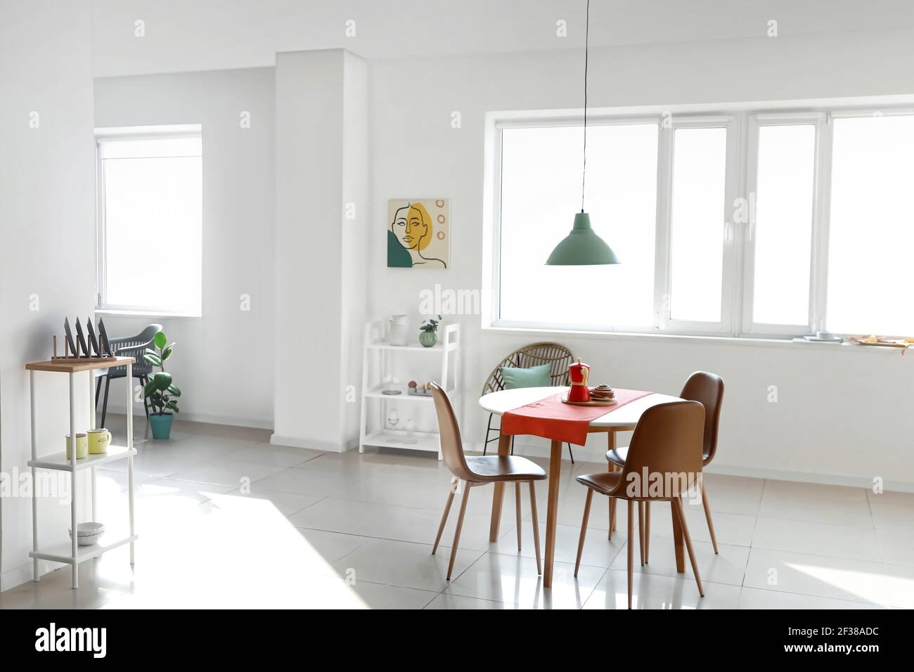 Dining table in interior of living room Stock Photo - Alamy