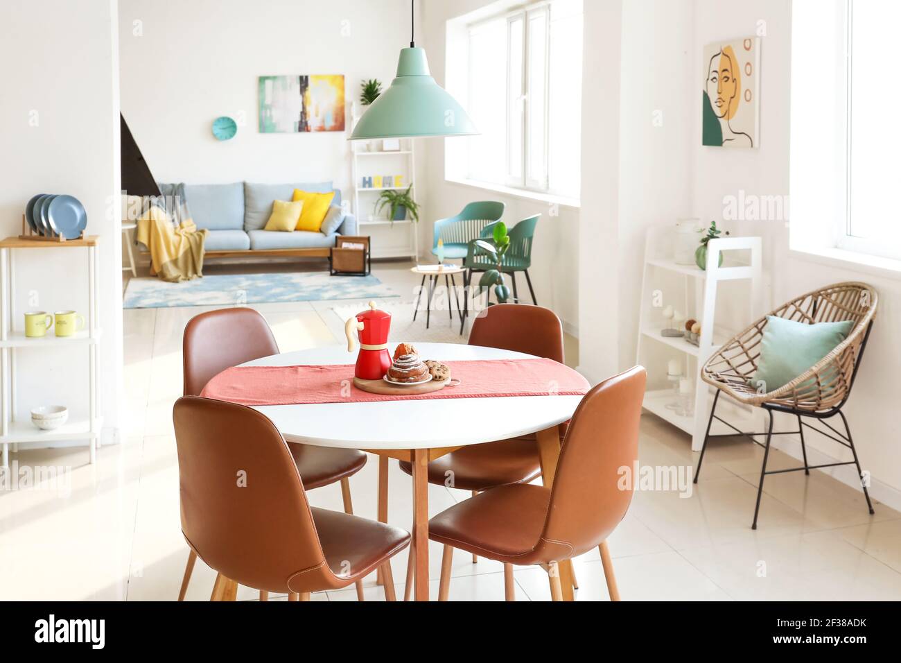 Dining table in interior of living room Stock Photo - Alamy