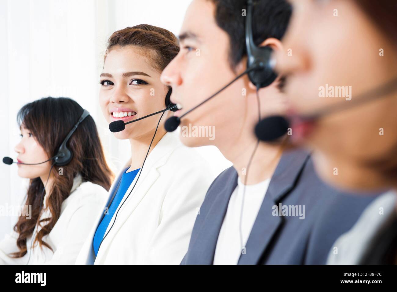 Call center (operator or telemarketer) team - telemarketing and customer service concepts Stock Photo