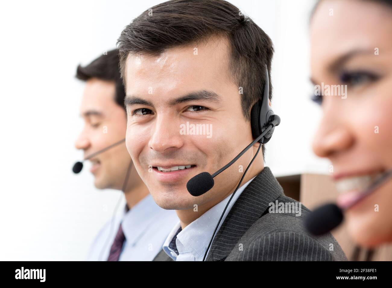 Business people wearing microphone headset - telemarketing, operator, call center and customer service concepts Stock Photo