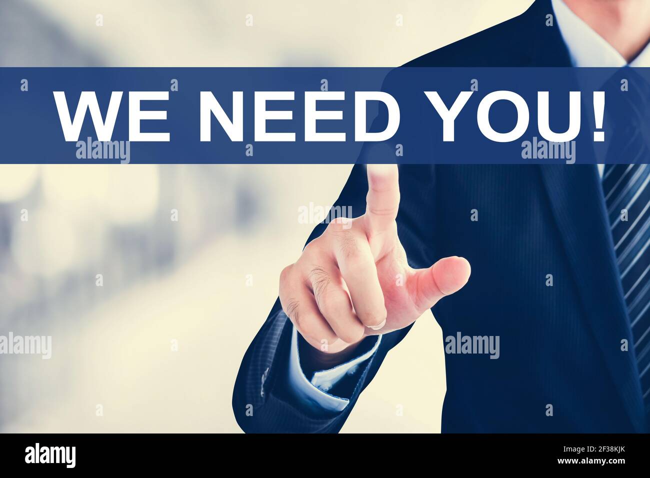 Businessman hand touching WE NEED YOU! message on virtual screen Stock Photo
