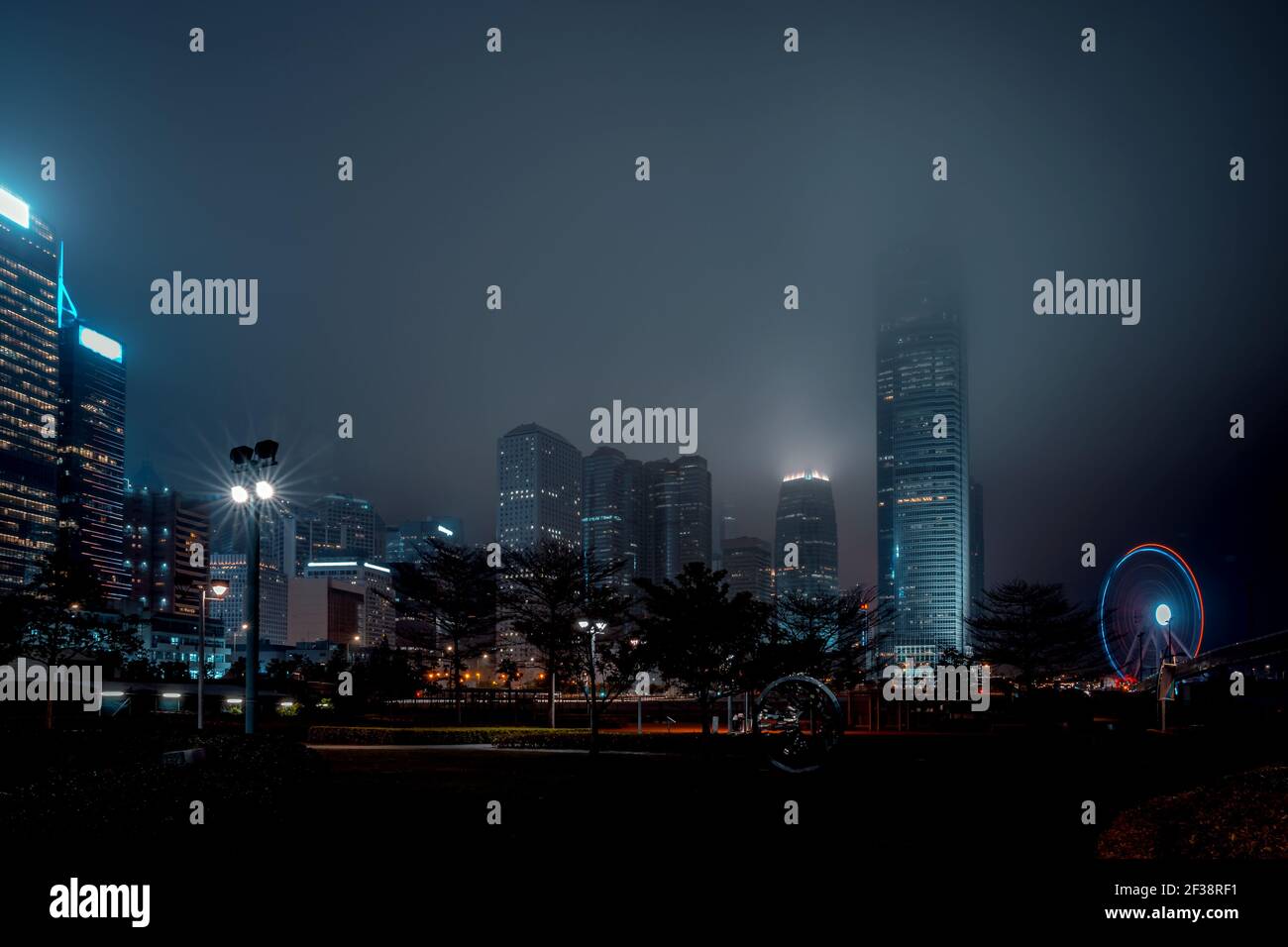 Modern office buildings in Hong Kong at foggy night Stock Photo - Alamy