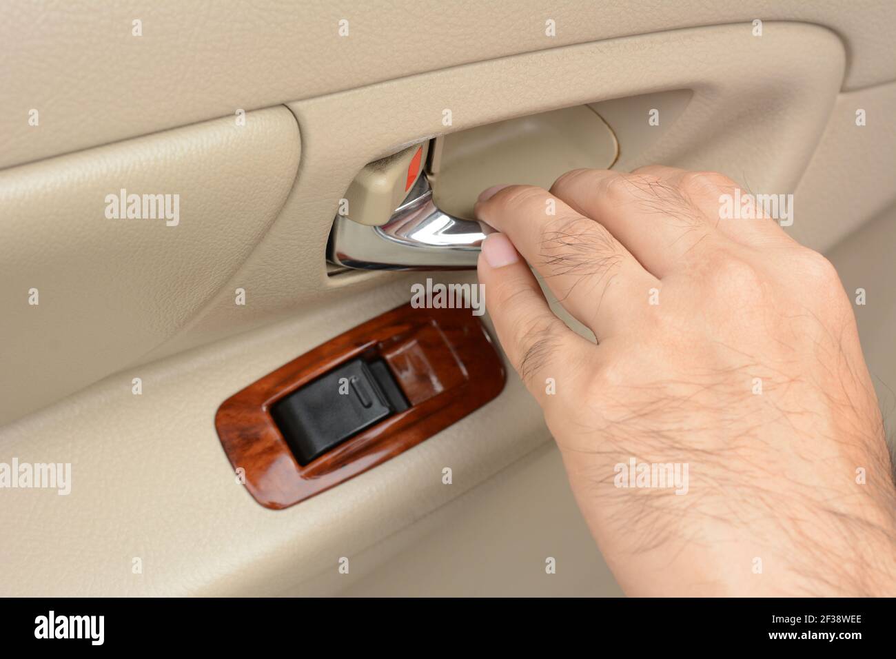 Hand pulling car interior door handle, opening car door Stock Photo Alamy