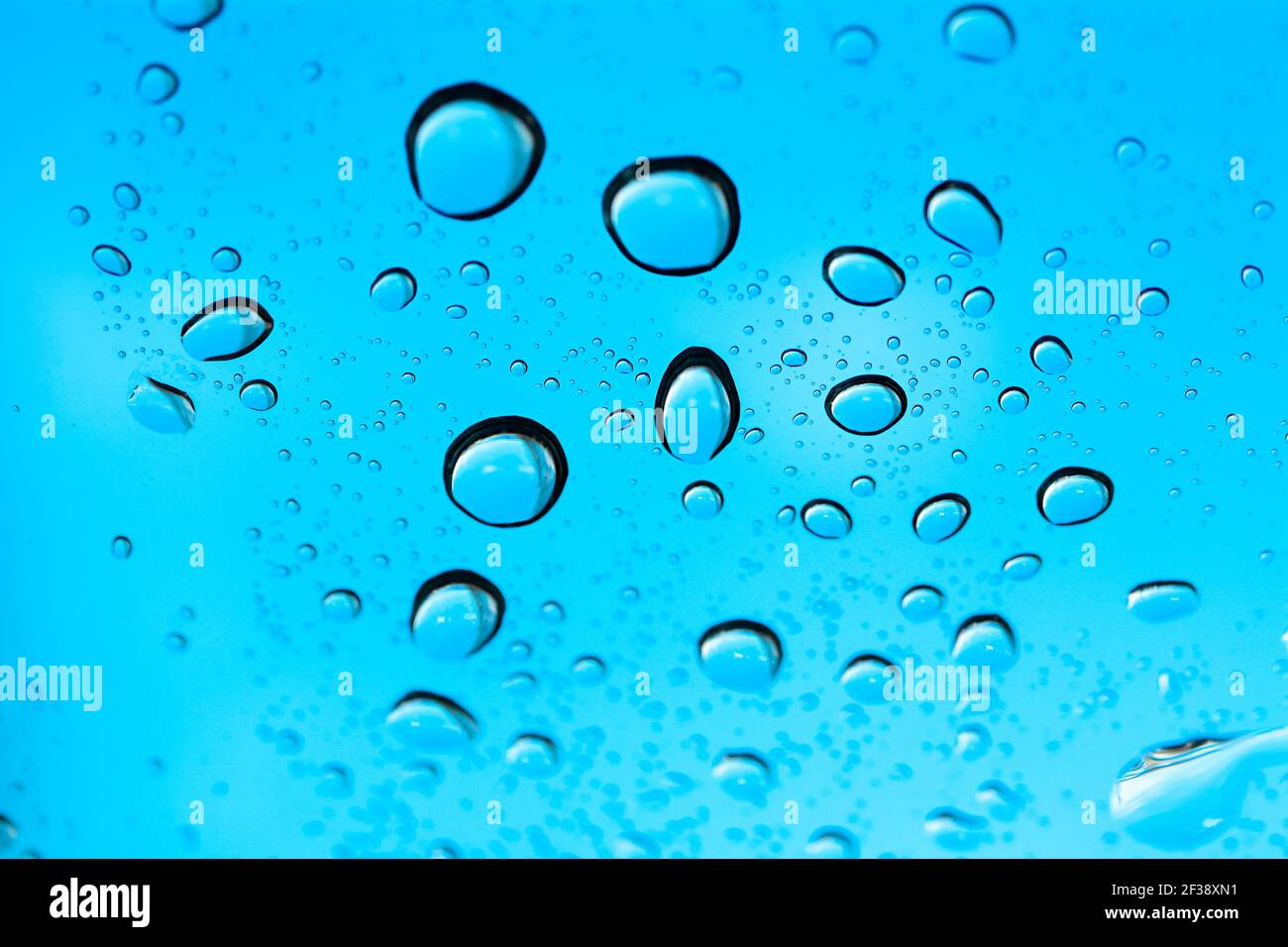 Closed up of water drops on light blue background Stock Photo - Alamy