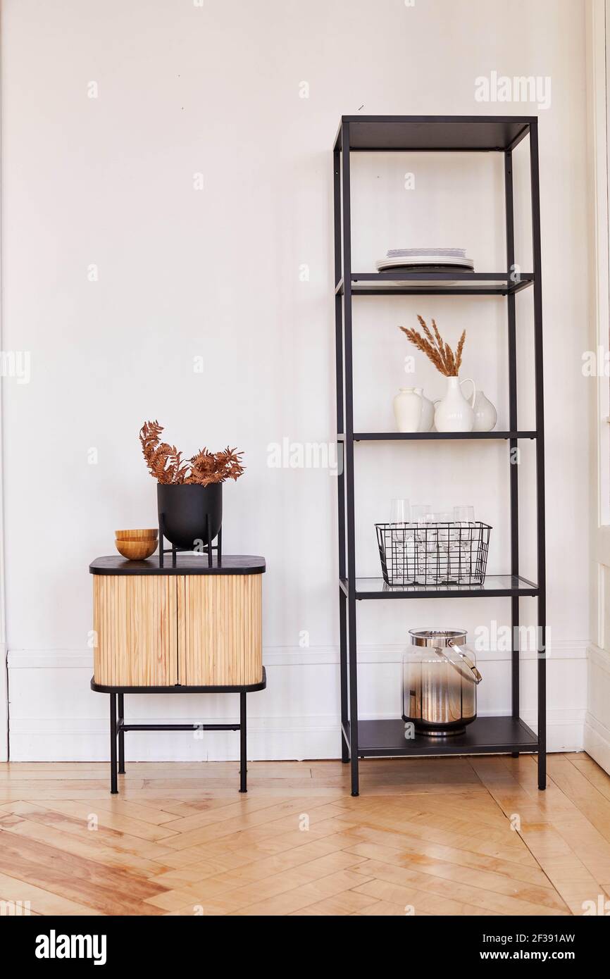 Modern metal shelves and wooden with assorted decorations