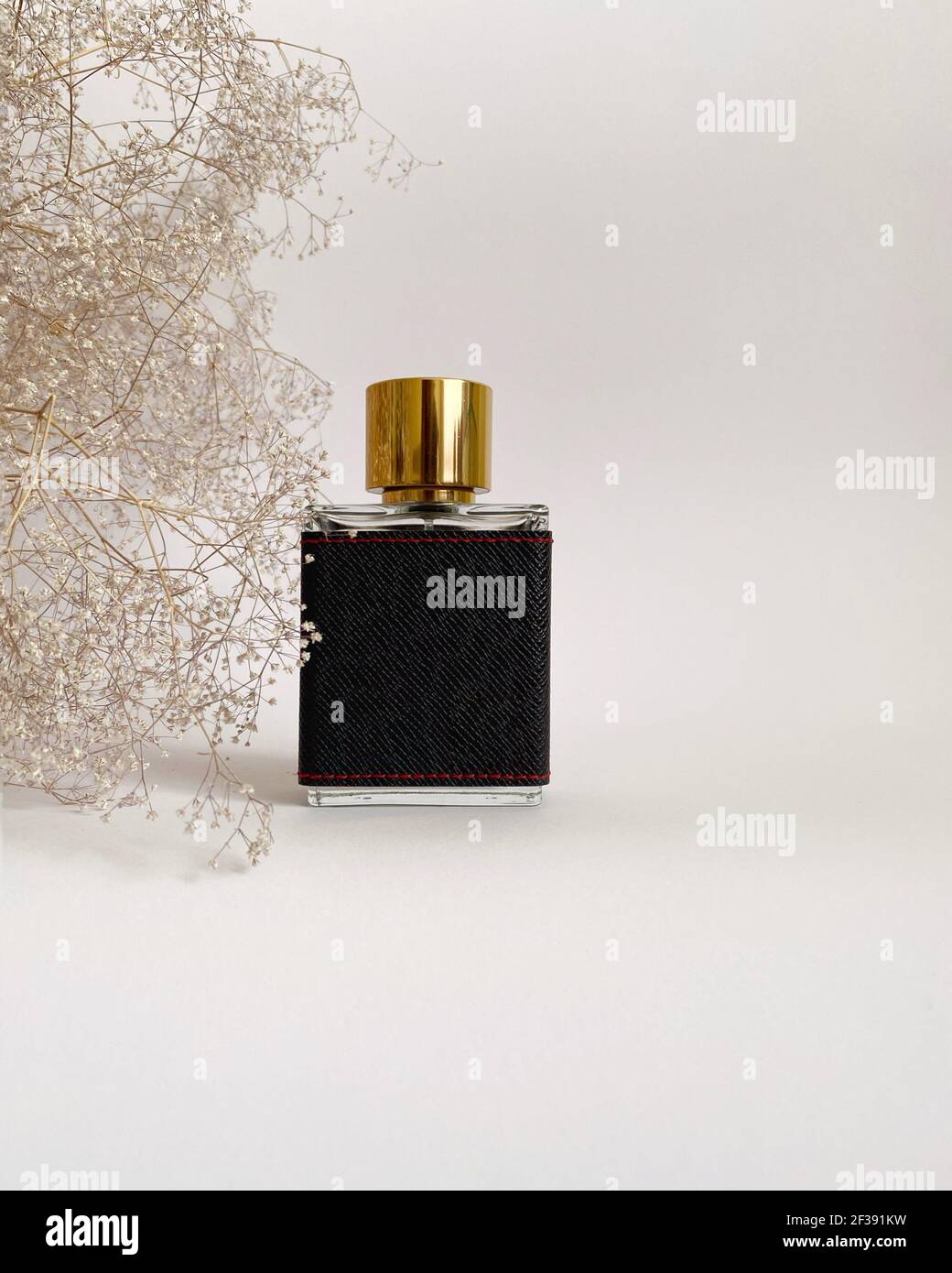 Men's perfume closeup on a white isolated background. Men's perfume in
