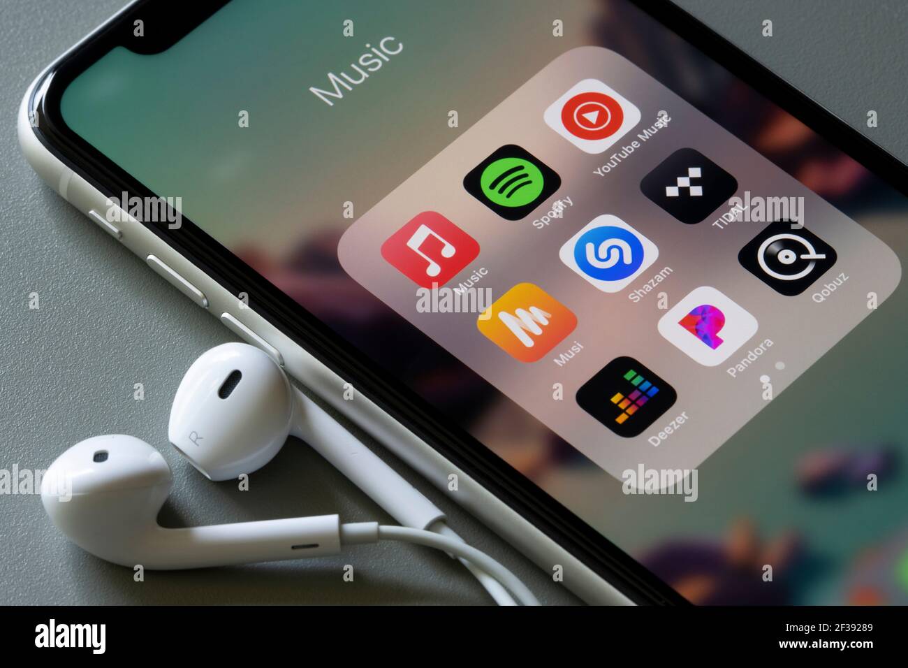 Assorted music apps are seen on an iPhone - Apple Music, Spotify, YouTube Music, Musi, Shazam, TIDAL, Deezer, Pandora, and Qobuz. Stock Photo