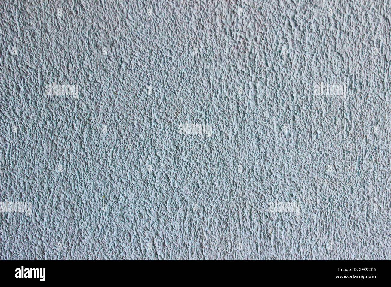 Abstract Grunge Decorative Light Blue Plaster Wall Background with Winter Pattern. Rough Stylized Texture Wide Screen With Copy Space for Design Stock Photo