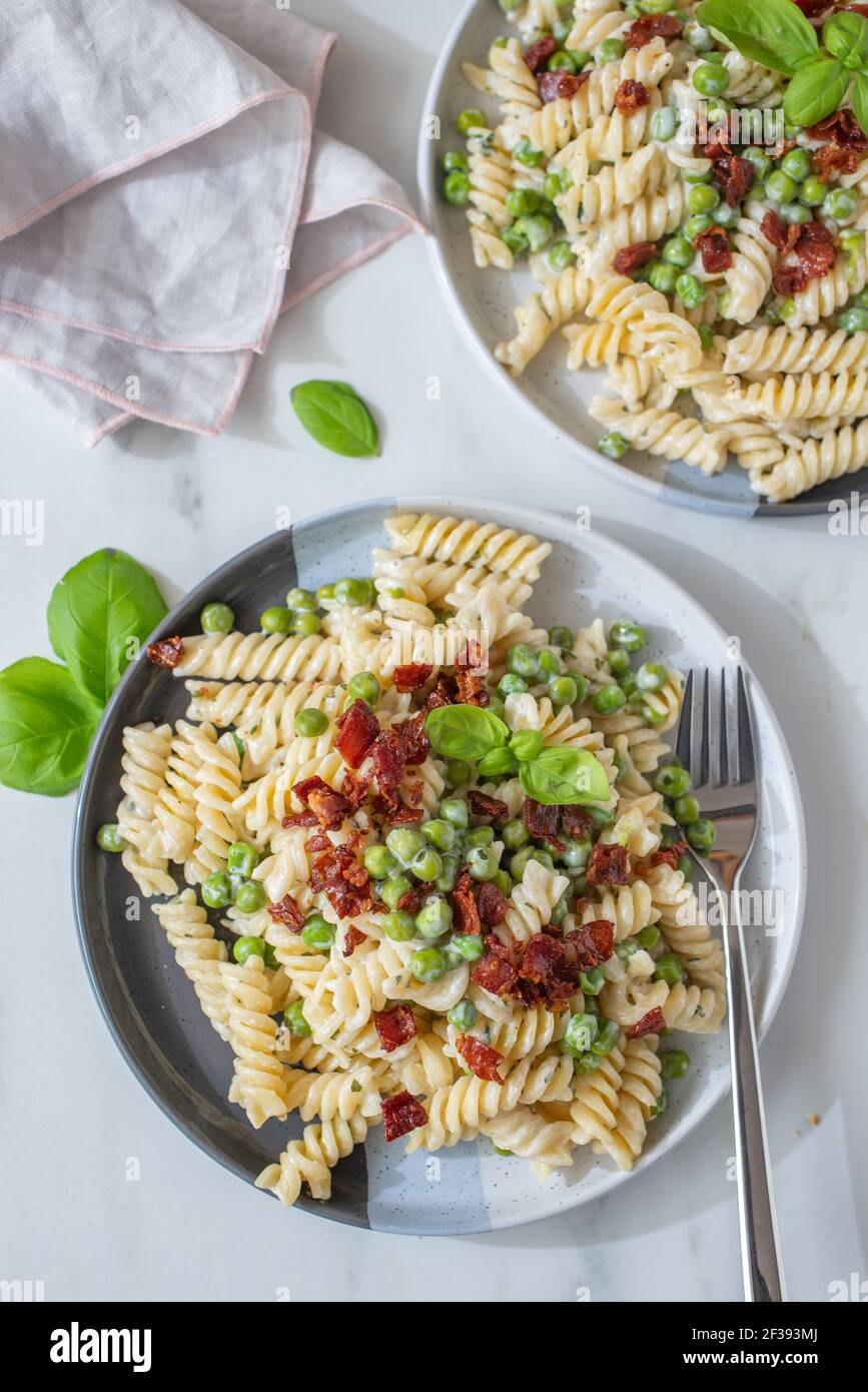 healthy home made ricotta pasta with bacon and peas Stock Photo Alamy