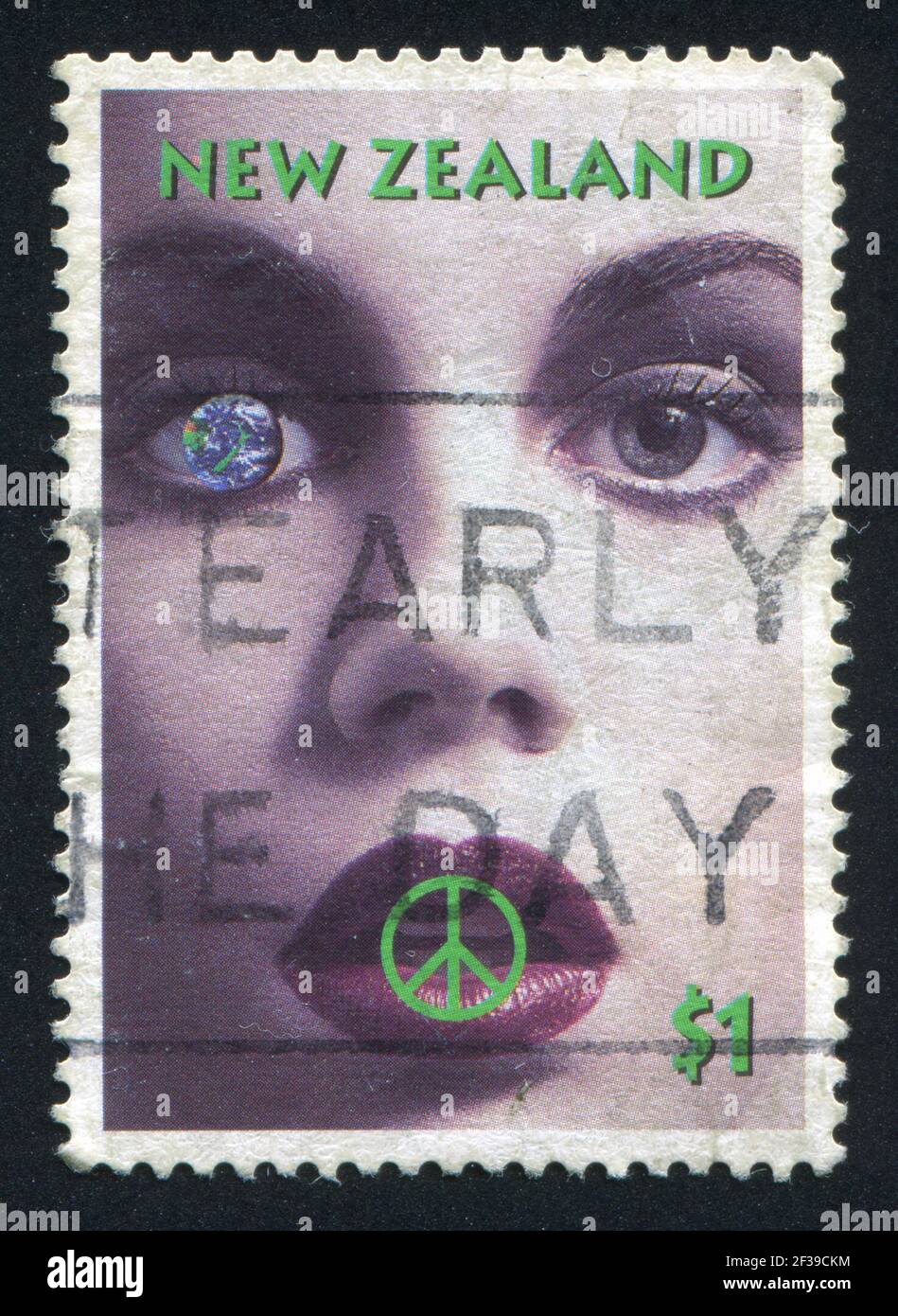 NEW ZEALAND - CIRCA 1995: stamp printed by New Zealand, shows Woman Face, Campaign for Nuclear Disarmament Symbol and Planet Earth, circa 1995 Stock Photo