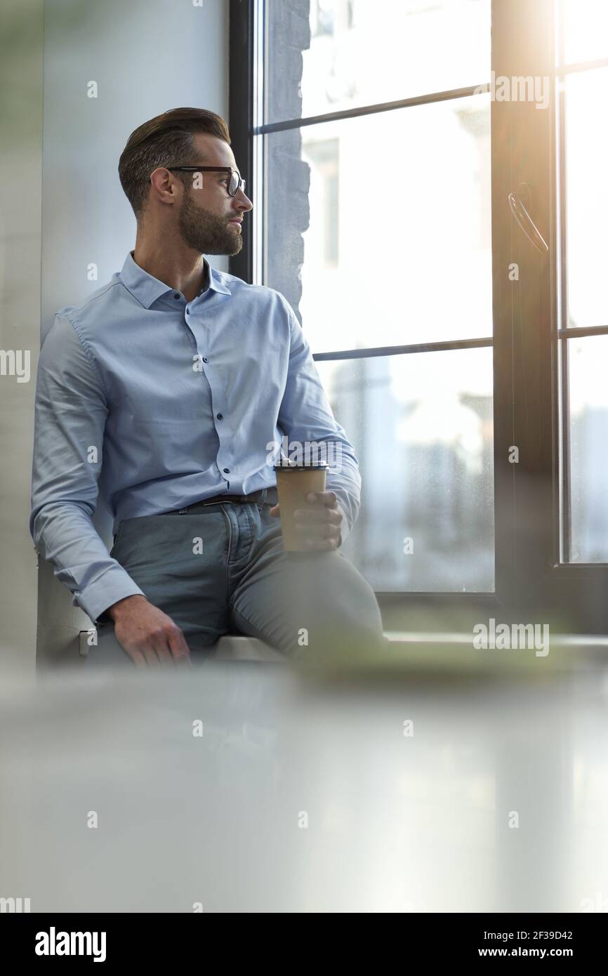 Getting distracted from work by looking outdoors Stock Photo