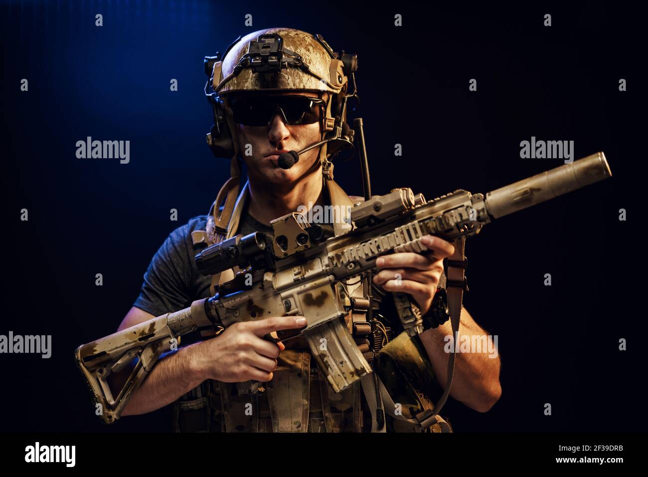 Special forces soldier with rifle on black background Stock Photo - Alamy