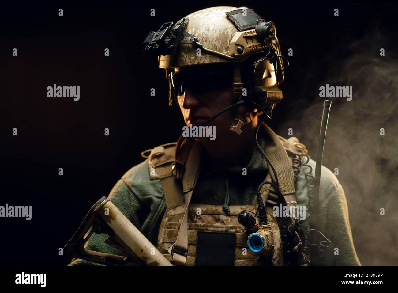 Special forces soldier with rifle on black background Stock Photo - Alamy