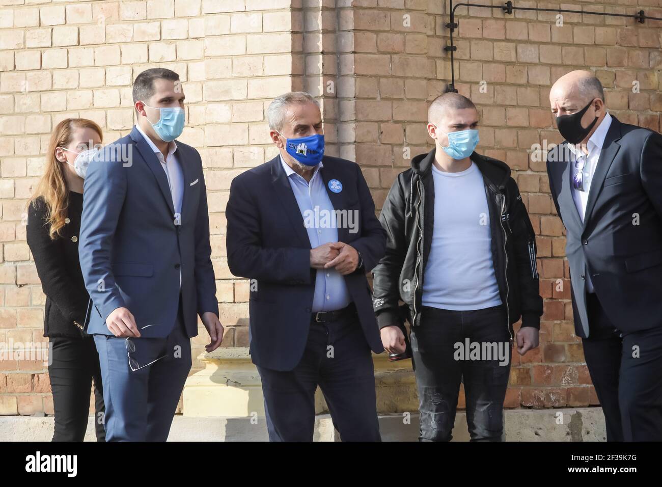 Zagreb Mayor Milan Bandic (in the middle with a blue canvas mask on his face that says Zagreb) at the funeral of handball player Zlatko Saracevic Stock Photo